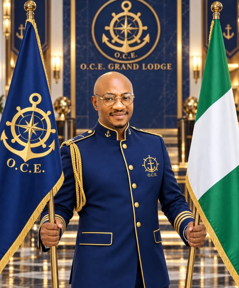 Dr A. M. Moses, Grand Patron of O.C.E Grand Lodge, in formal regalia holding the O.C.E and Nigerian flags